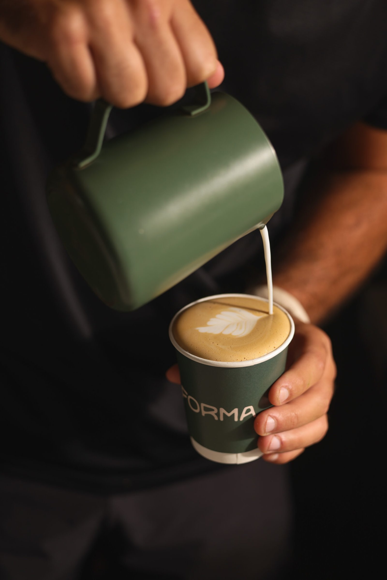 Latte art poured into a Forma coffee cup at the Catford wellness bar
